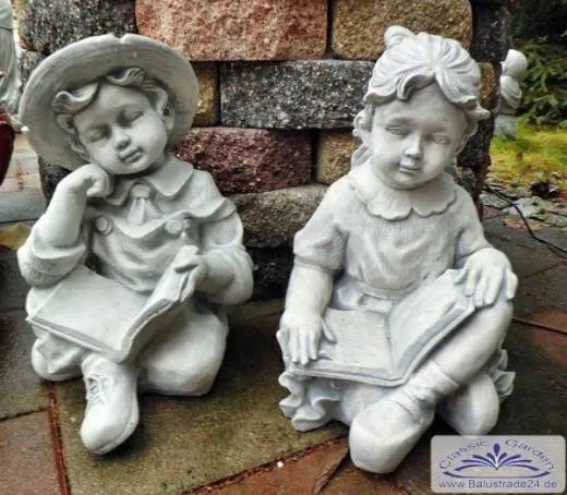 S101145 Kinderfiguren Mädchen und Junge sitzend mit Buch als Gartenfiguren Steinfiguren aus Beton Steinguss Figuren